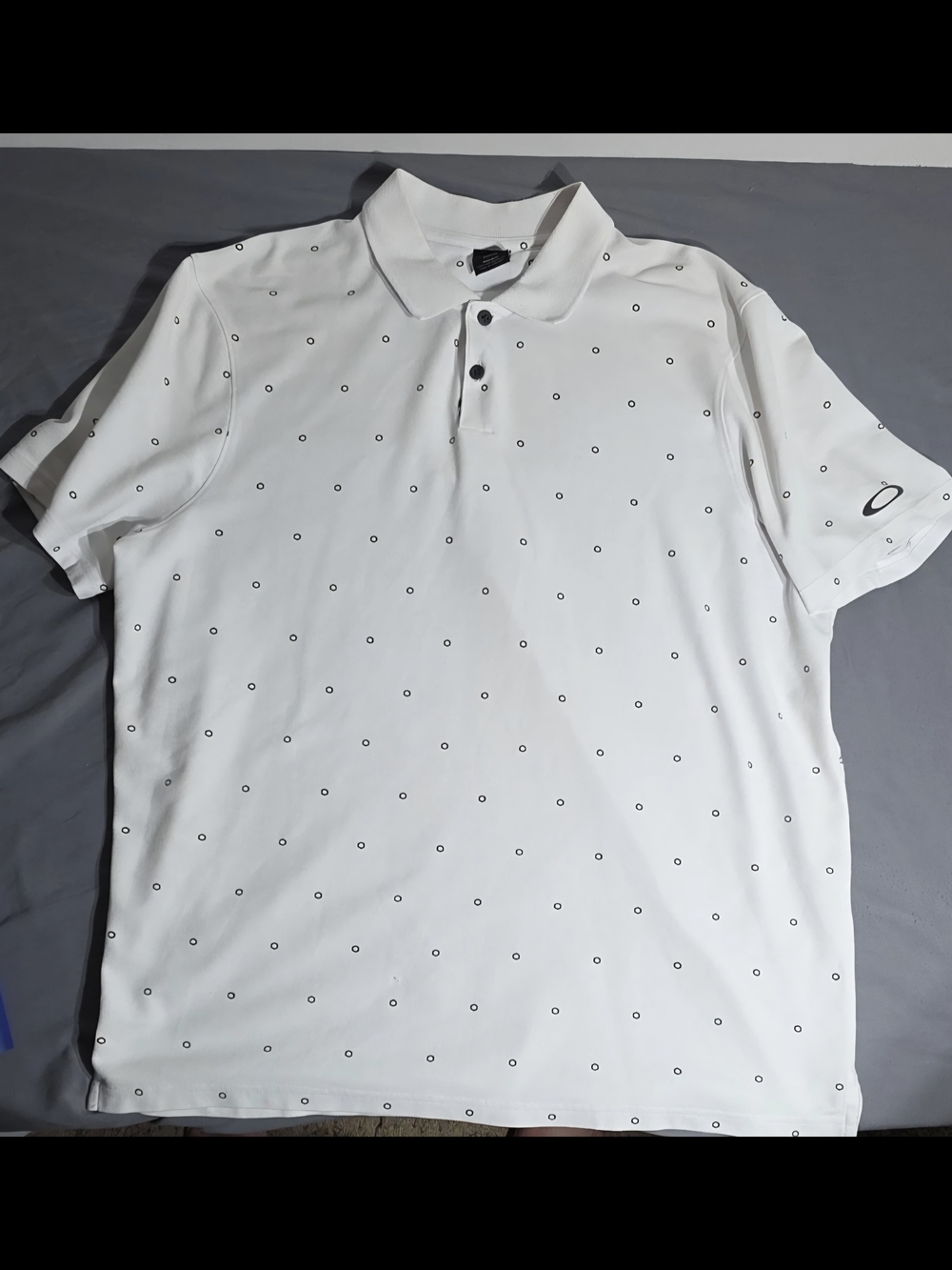 Oakley White Polo with Small Black Ring Print